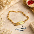 Personalized Gold Finish Beaded Name Bracelet Rakhi for Women