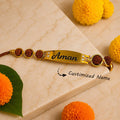 Personalized Gold Finish Rudraksha Name Rakhi for Brother