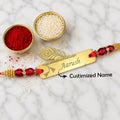 Personalized Peacock Feather Gold Name Rakhi with Red Crystal Beads