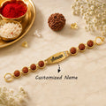 Personalized Rudraksha Name Bracelet Rakhi with Gold Finish – Custom Engraved Raksha Bandhan Gift for Brother