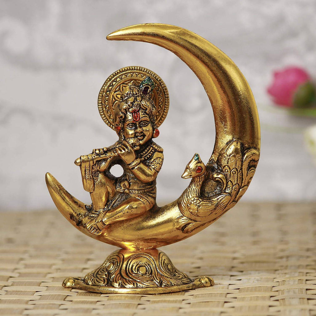 Golden Metal Handcrafted Lord Krishna Idol Playing Flute and Sitting On Half Moon Decorative Showpiece for Home Decor - Ideal Gift for Krishna Janmashtami, Housewarming, Wedding