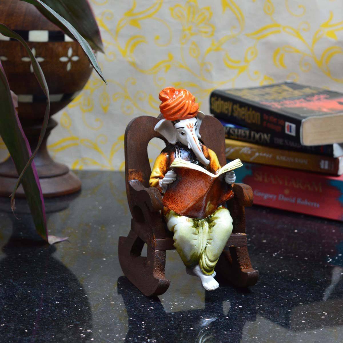 Lord Ganesha Reading Book on Wooden Chair (LxWxH - 4INx5INx6.5IN)